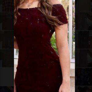 Homecoming dress worn once. Thick velvet sequence material. Mid thigh length.